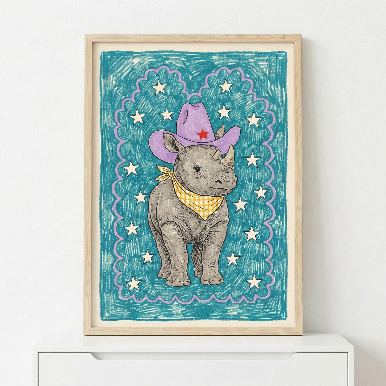 Framed illustration of a baby rhino wearing a purple cowboy hat with a red star and a yellow checkered bandana, standing against a teal background with white stars. The playful, hand-drawn style makes it perfect for nursery or toddler room decor.