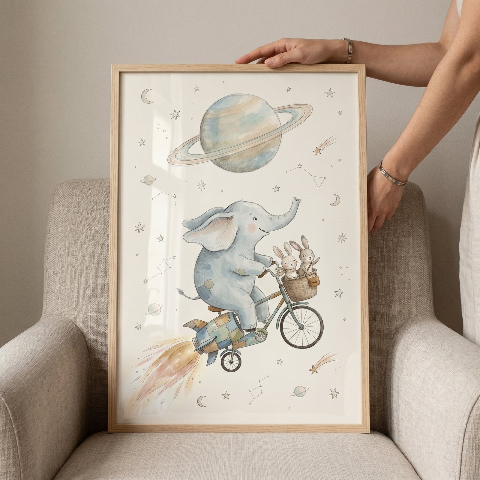 Rocket bicycle space animals wall art features an elephant and bunnies riding past a ringed planet and stars.
