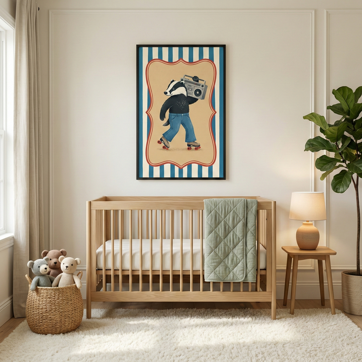 A bright and airy nursery features a light-colored wooden crib centered against a pale wall with decorative molding. A white mattress and a sage green quilted blanket rest inside the crib. Above it hangs a framed illustration of a badger character on roller skates, wearing blue jeans and a dark top while carrying a portable music player. The artwork has a red scalloped border and a blue and white striped background.