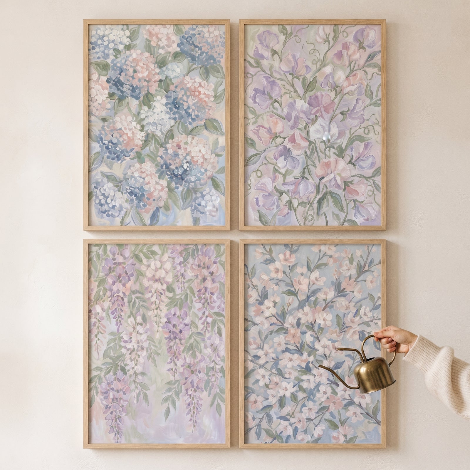 Romantic blush lavender bloom floral artwork set of 4 on a wall with a hand holding a small gold watering can.