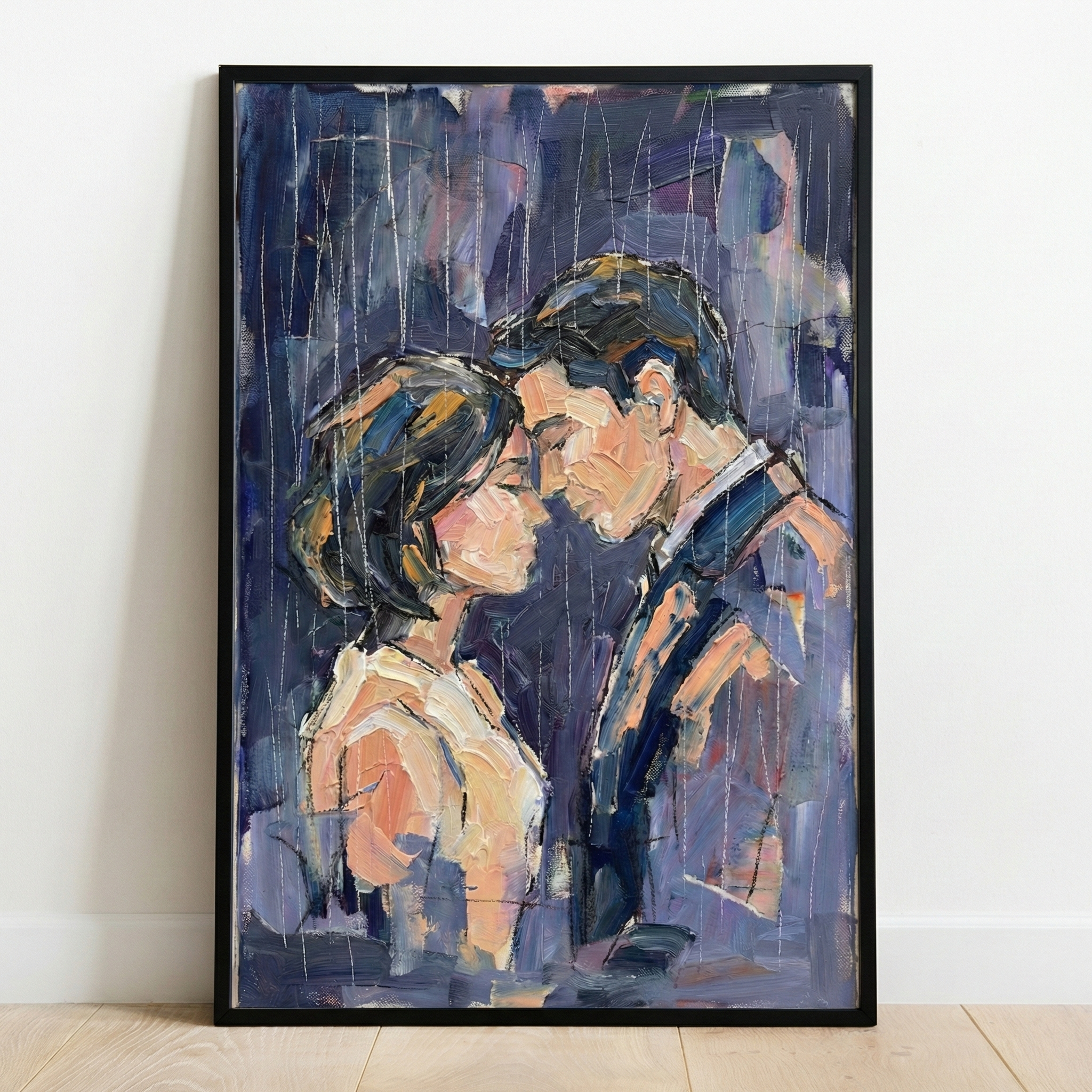 An impressionistic artwork framed in black and resting against a white wall on a wooden floor. The piece captures an intimate moment between two people, a man and a woman, portrayed from the chest up. They face each other with eyes closed, their foreheads almost touching in a gentle embrace. 

