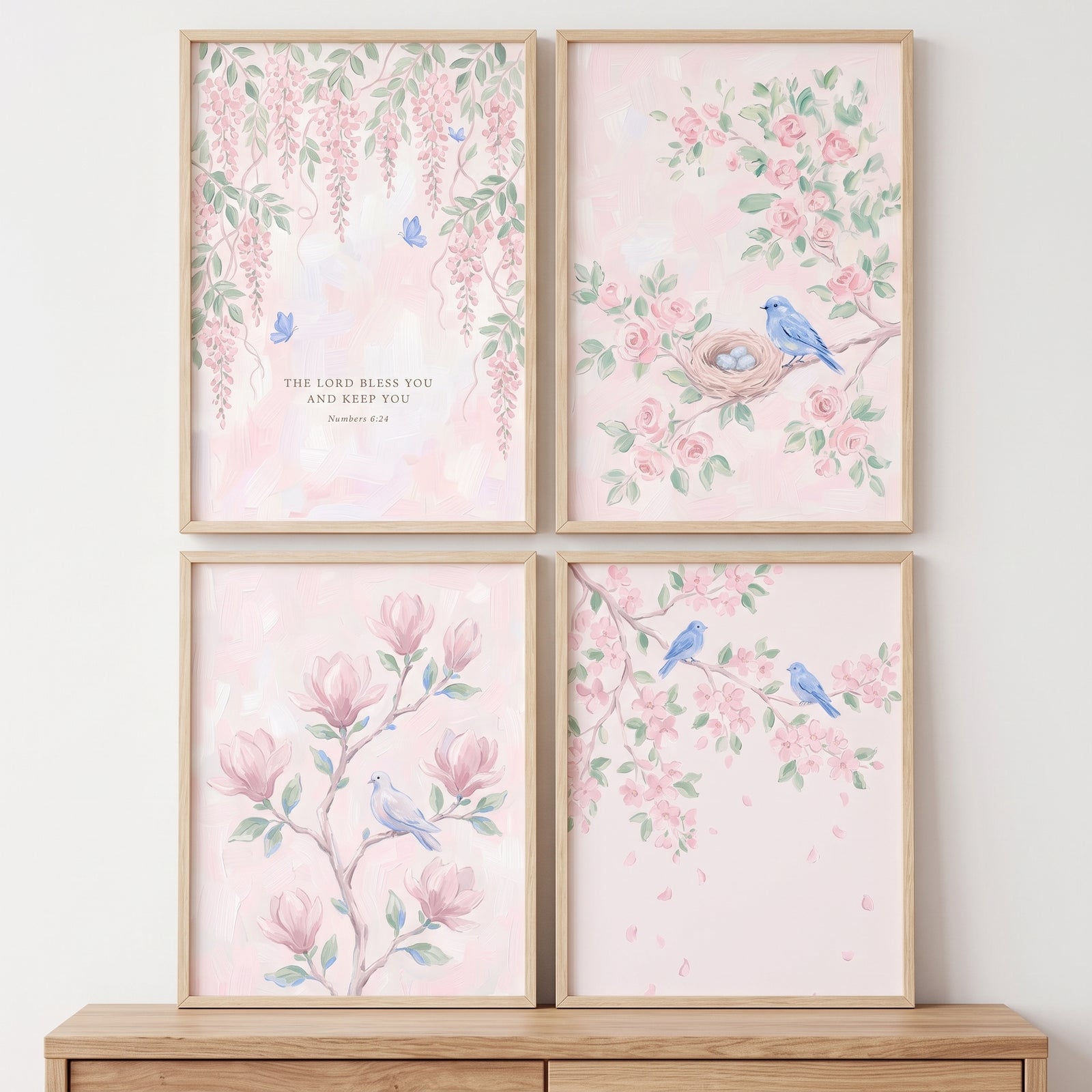 Romantic watercolor pink garden wall art set of 4 depicts blue birds, blossoms, and a scripture verse in wood frames.