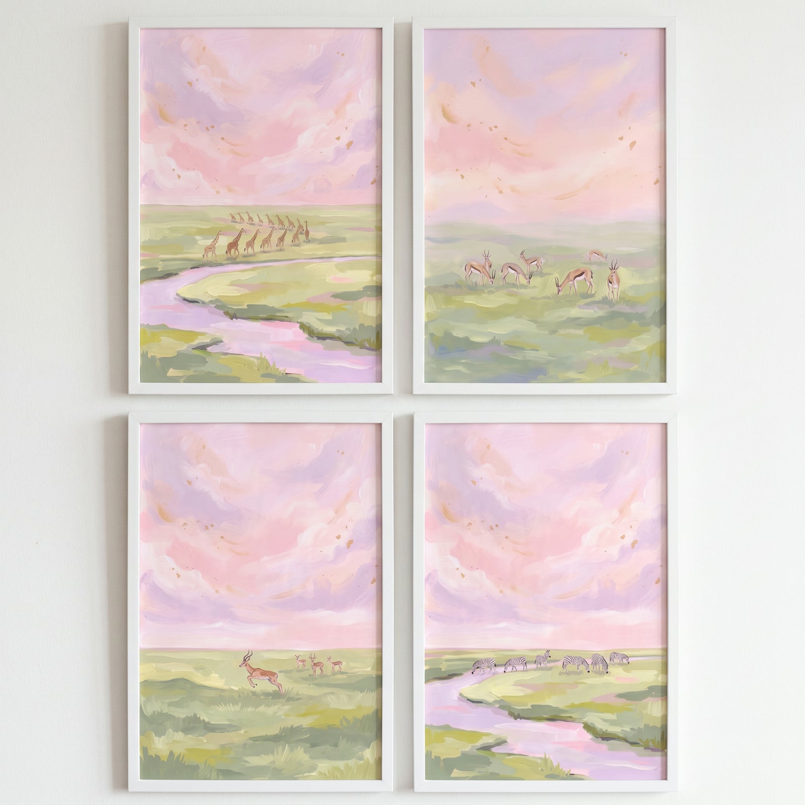 Rose colored safari animals wall art set of 4 features giraffes, zebras, and gazelles under a soft pink sunset sky.