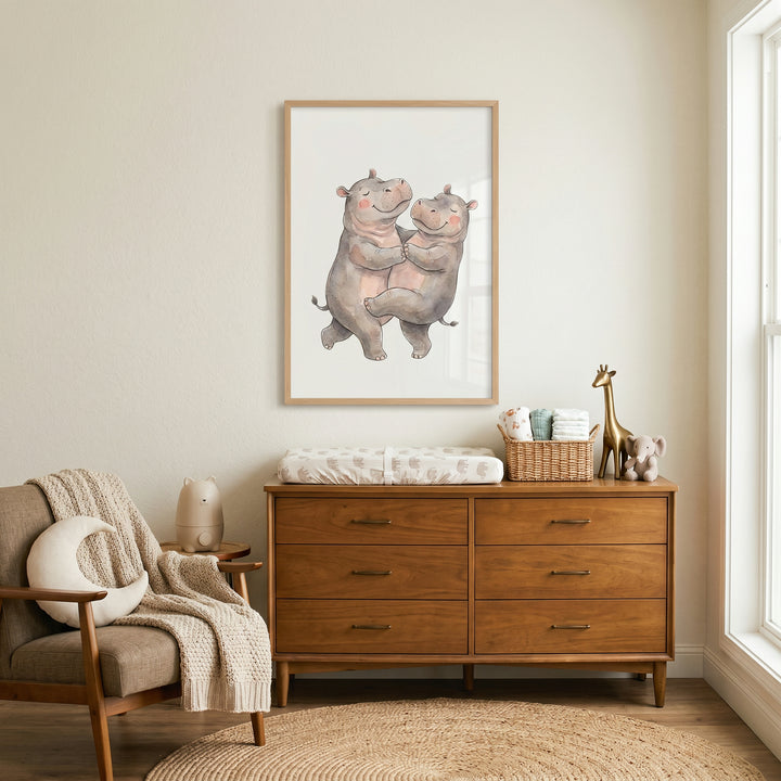 Nursery with a wooden dresser, armchair with moon pillow, and rosy cheek hugging hippo wall art.