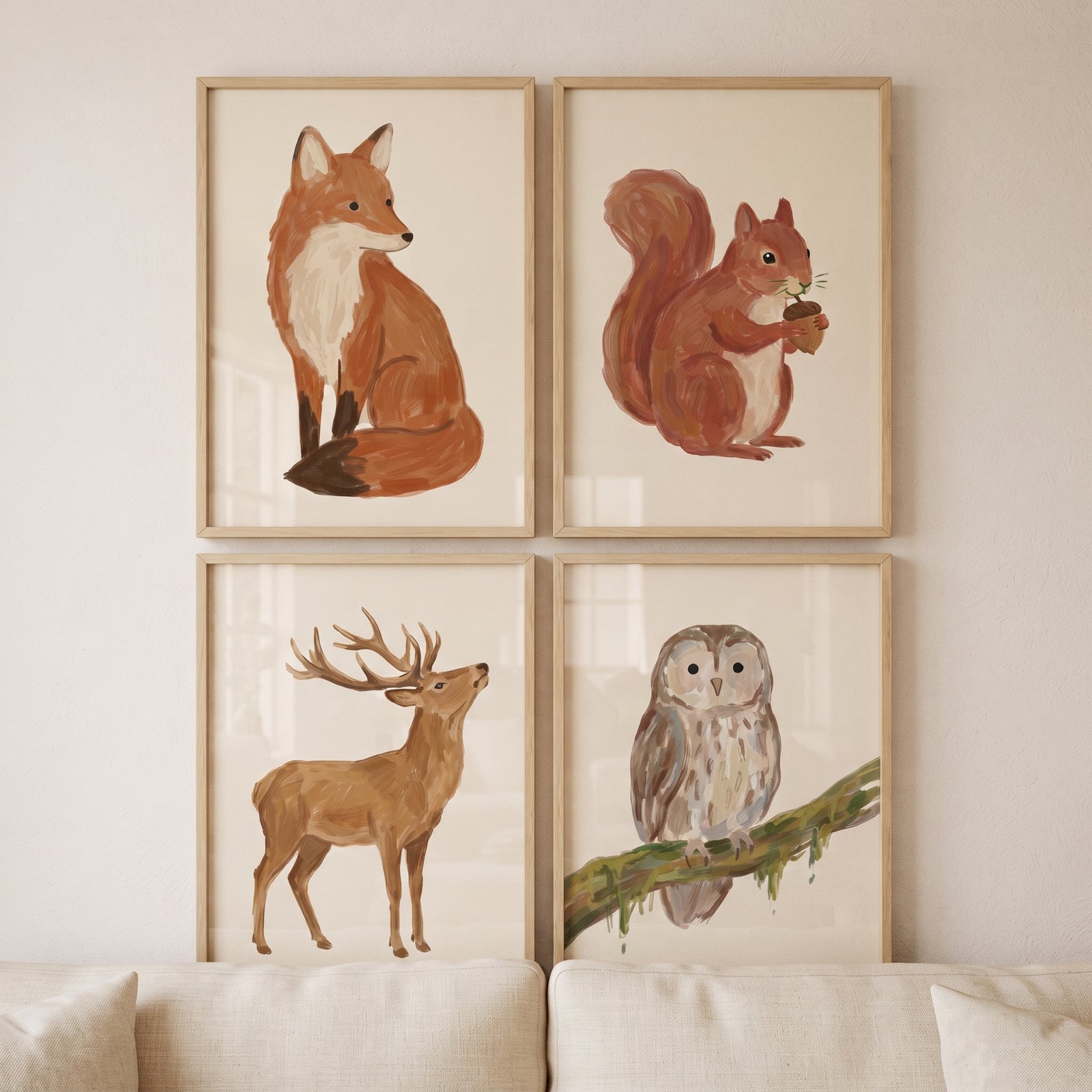Rustic earthy forest animals wall art set of 4 featuring a fox, squirrel, deer, and owl in light wood frames.