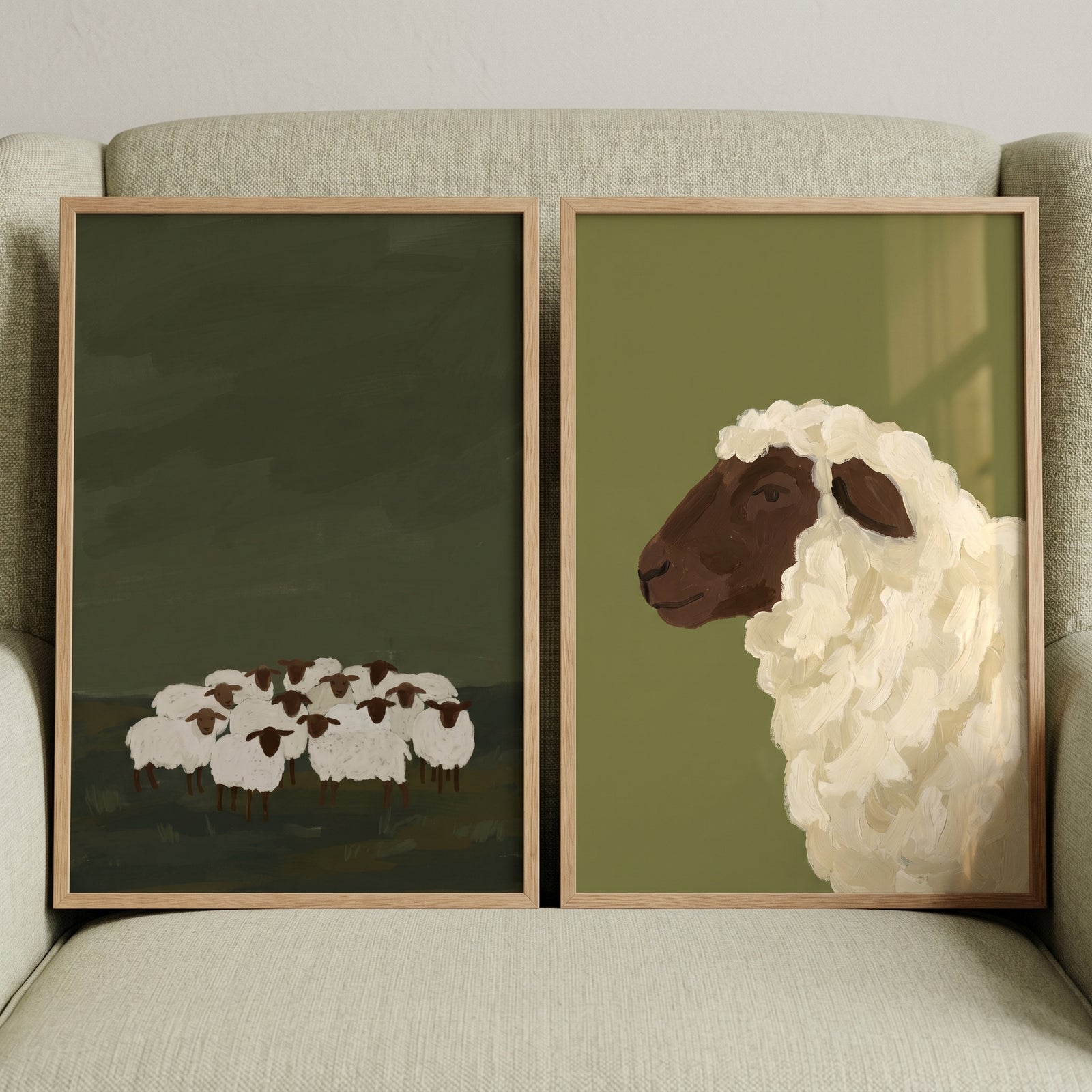Rustic olive green sheep wall art set of 2 features a distant white flock and a close-up sheep head profile.