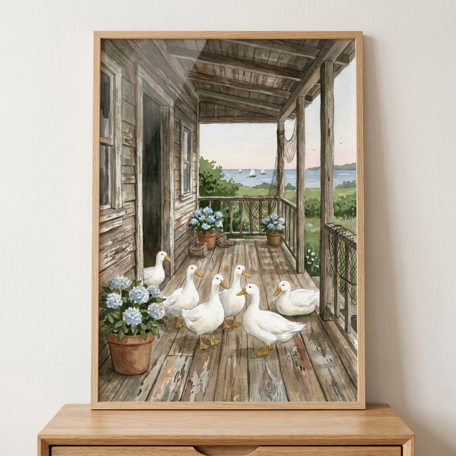 Rustic porch white duck wall art featuring six white ducks on a weathered deck near blue hydrangeas and sailboats.
