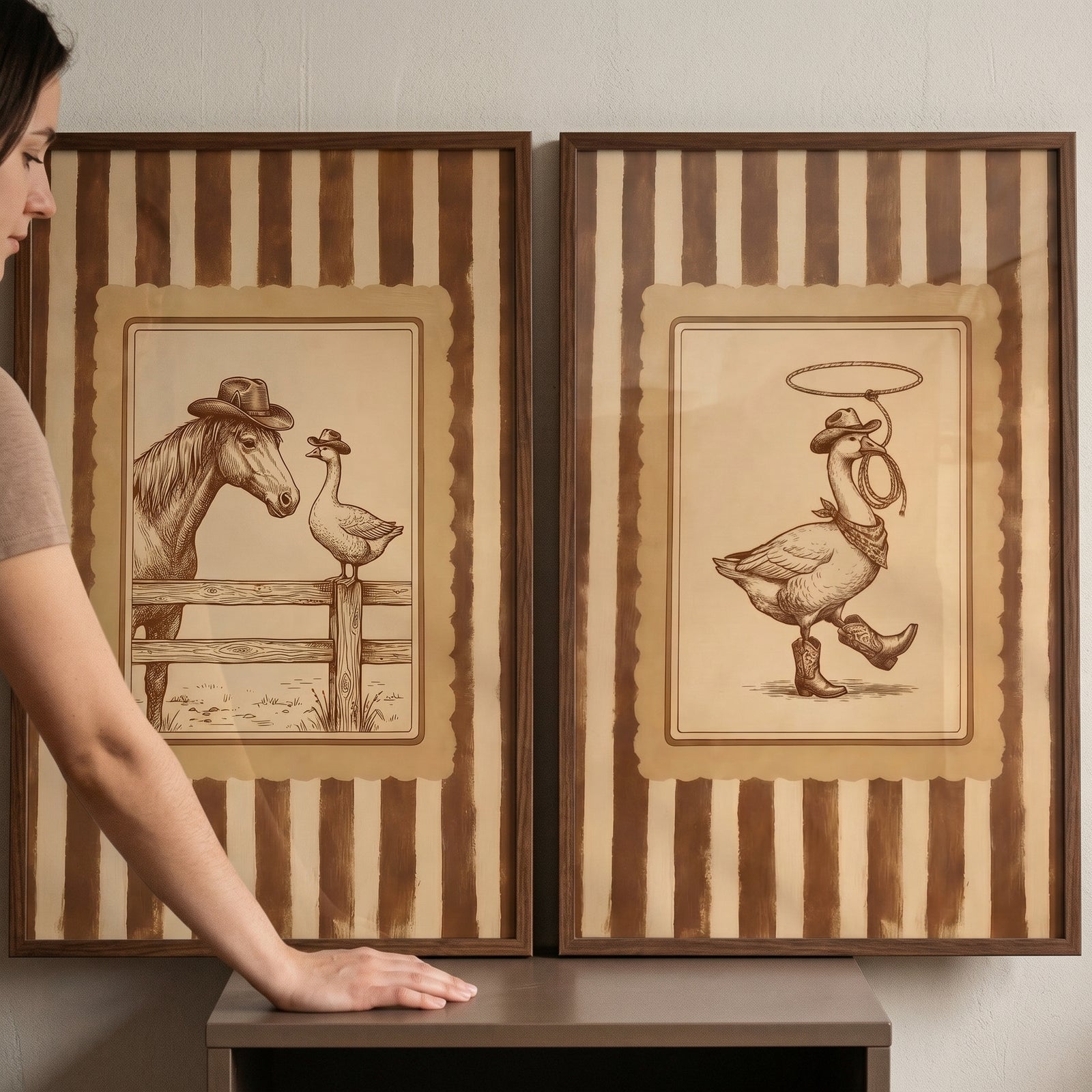 Rustic western sketch goose wall art set of 2 shows a horse and geese in cowboy hats and boots on striped backgrounds.
