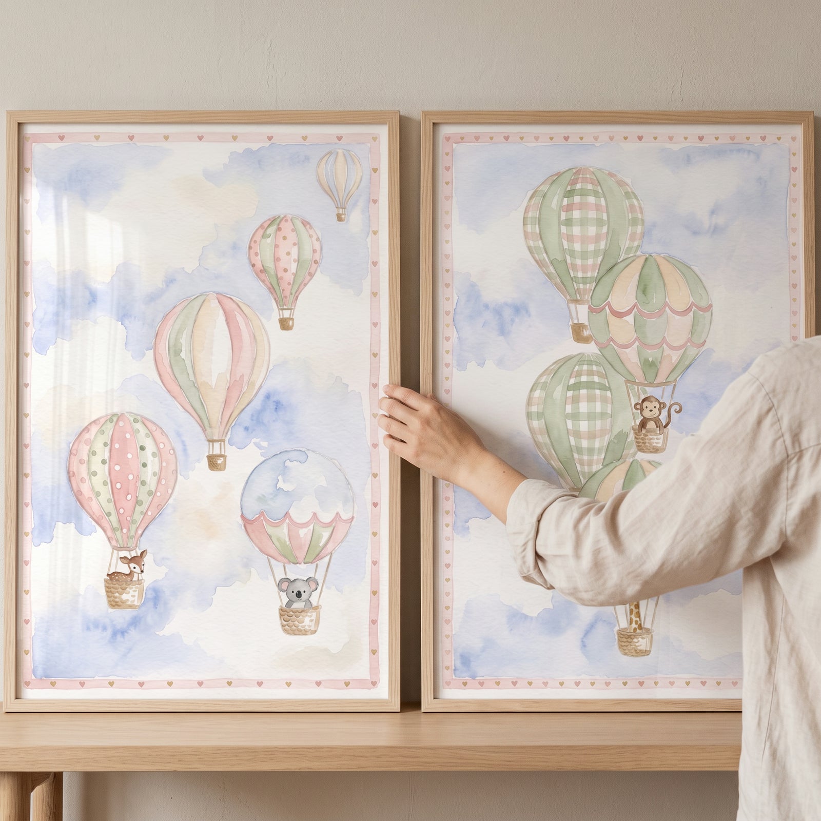 Framed safari balloon floating animal wall art set of 2 with a giraffe, monkey, deer, and koala in hot air balloons.