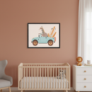 Nursery with a terracotta wall, light wood crib, gray armchair, and white dresser. A black-framed picture of a cartoon giraffe and an elephant in a blue jeep with surfboards hangs above the crib.
