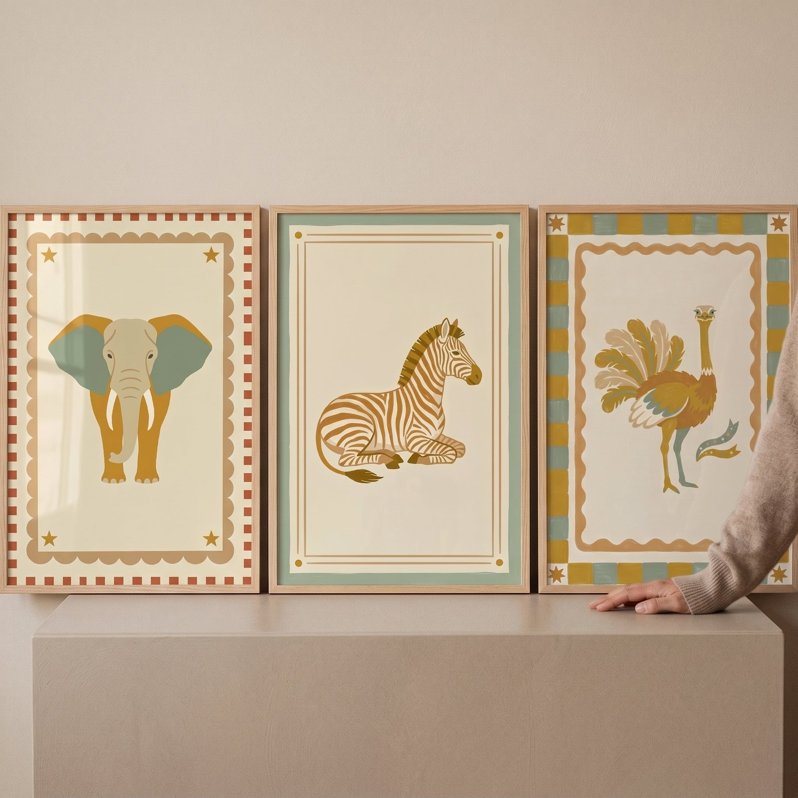 Sage cream safari animal wall art set of 3 featuring elephant, zebra, and ostrich illustrations in wooden frames.