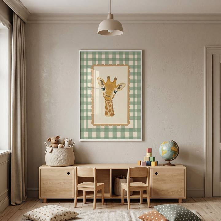 Sage green gingham giraffe wall art above a wooden desk with two chairs, toys, and a globe in a neutral children's room.