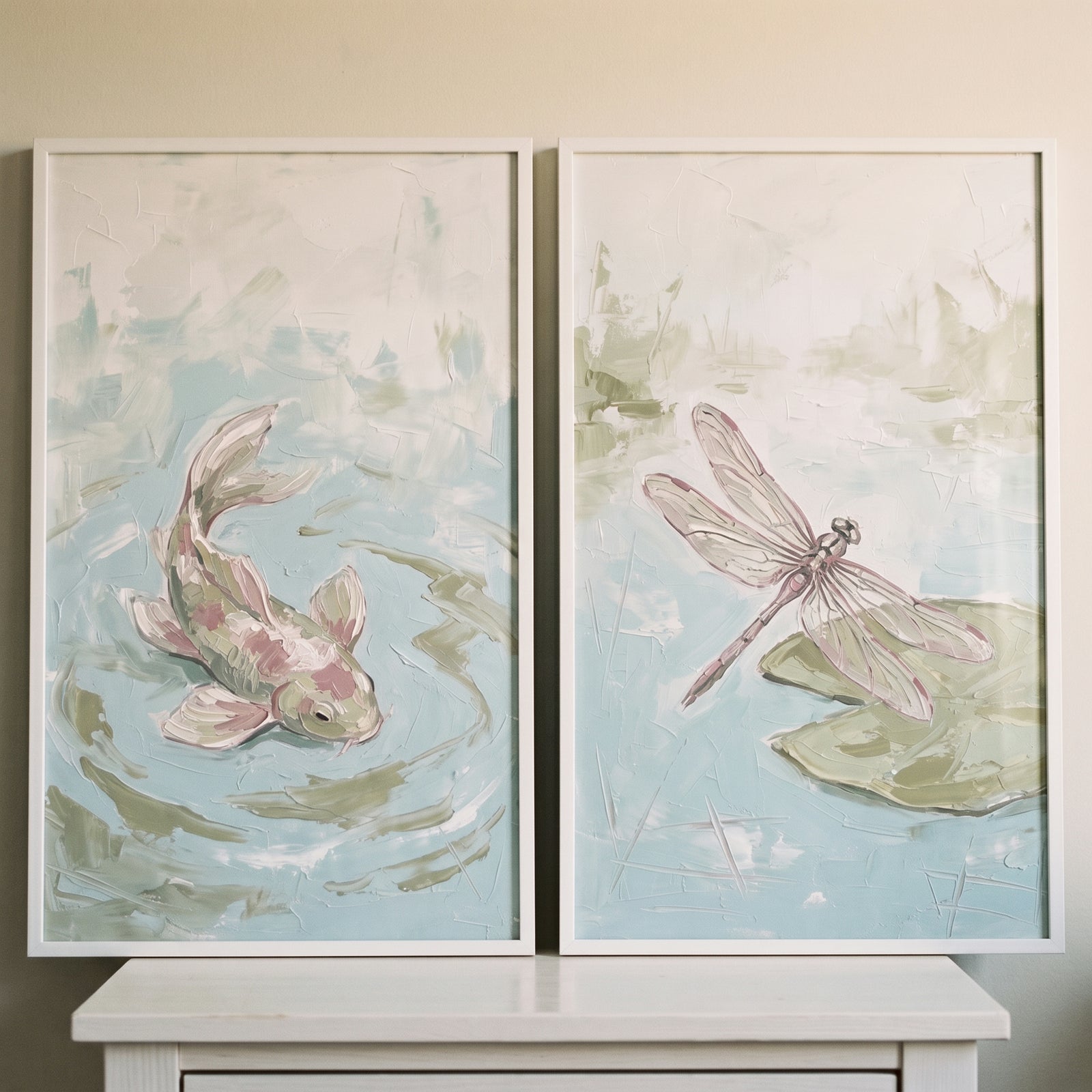 Sage green impasto nature wall art set of 2 with a koi fish swimming in a pond and a dragonfly resting on a lily pad.