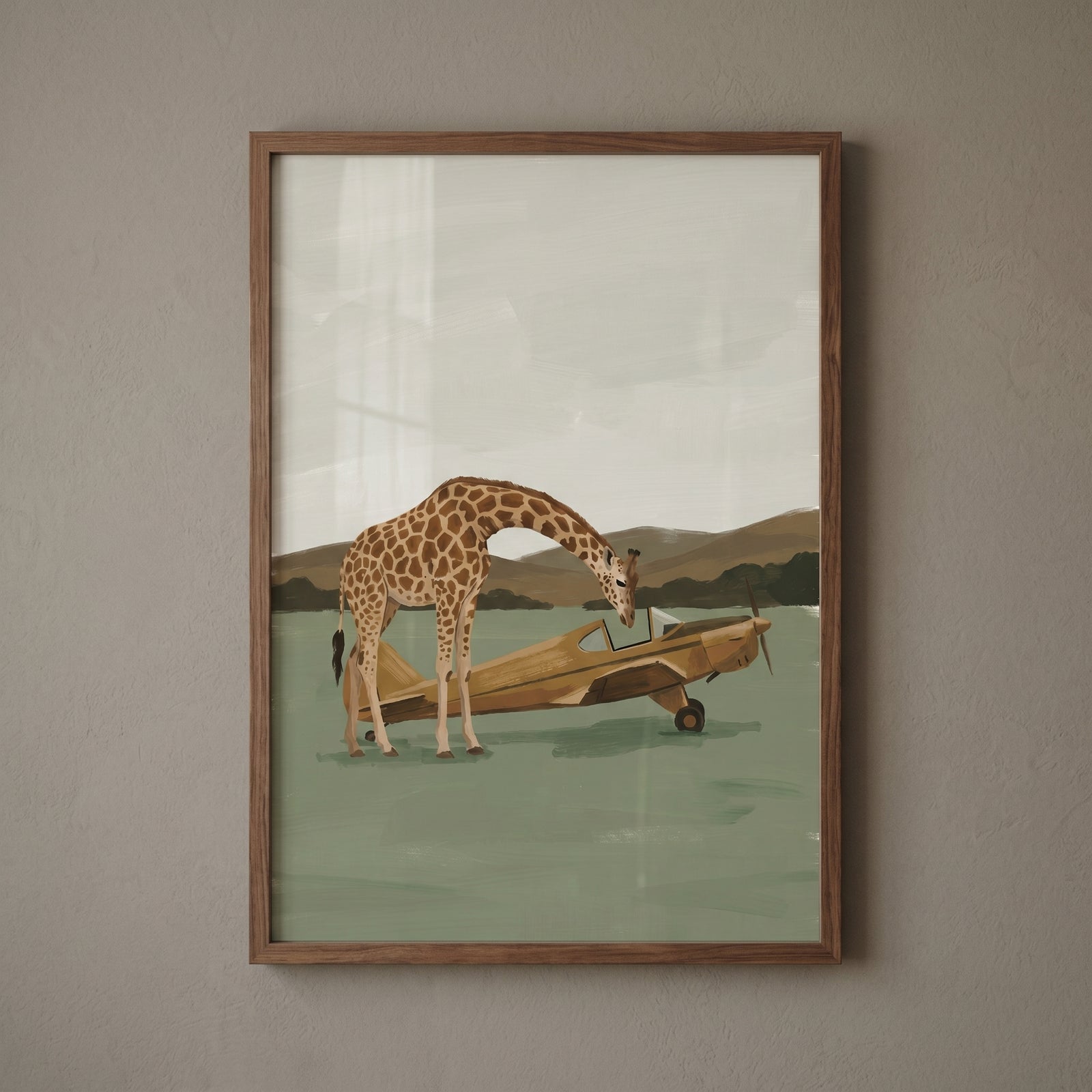 A giraffe peers into a yellow plane in this framed sage green plane giraffe wall art with a mountain background.