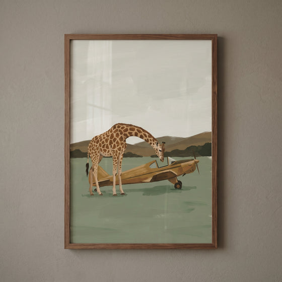 A giraffe peers into a yellow plane in this framed sage green plane giraffe wall art with a mountain background.