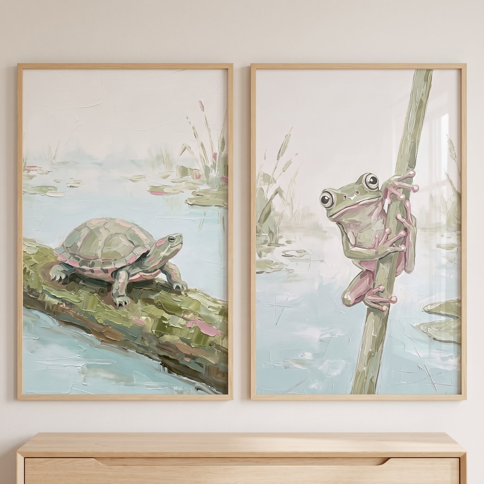 Sage impasto pond animals wall art set of 2 showing a turtle on a log and a frog climbing a reed in light wood frames.