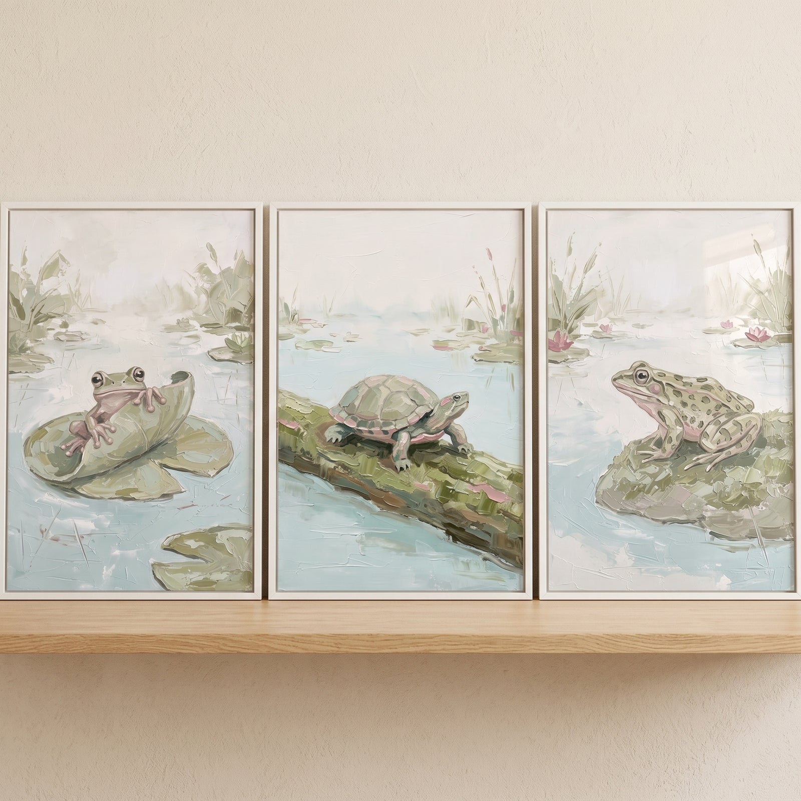 Sage impasto pond animals wall art set of 3 featuring a turtle and frogs in a soft green pond scene on a wooden shelf.