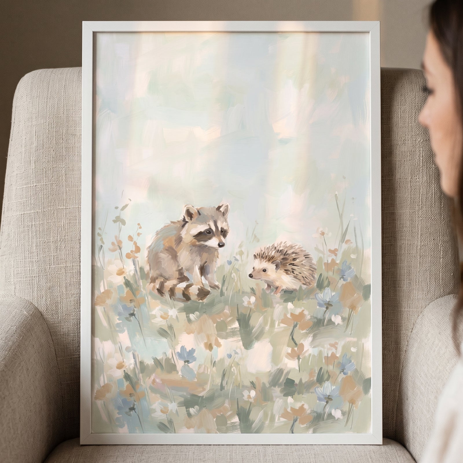 Sage woodland raccoon hedgehog animals wall art in a white frame depicts two forest creatures in a soft floral meadow.