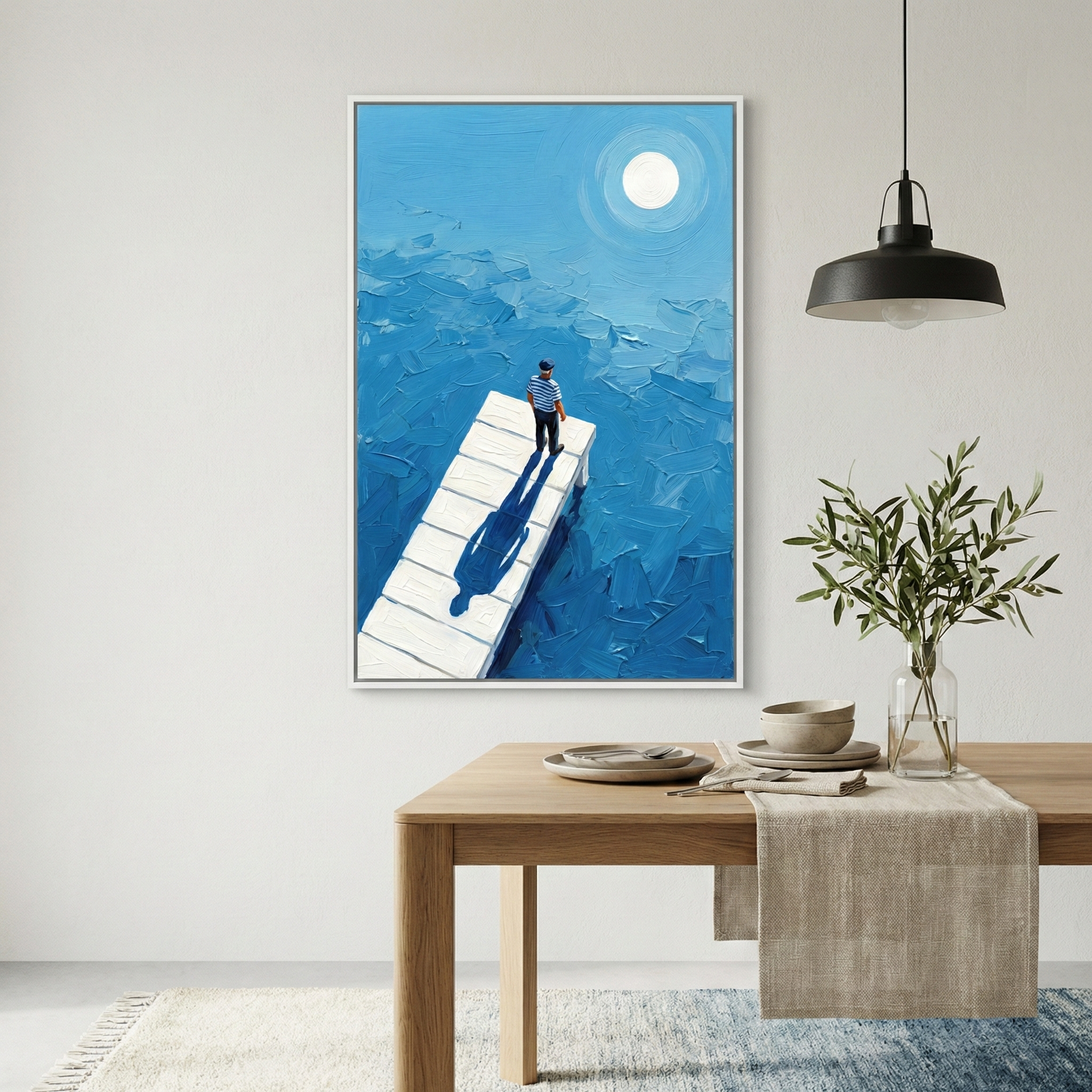 A rectangular vertical canvas hangs on a light grey wall, depicting a lone figure on a pier amidst a vast blue sea. The artwork is created with thick, textured strokes in various shades of blue, giving the water a dynamic, layered appearance. A small figure dressed in a striped top and dark trousers stands at the edge of a white wooden pier, looking out toward the horizon. 