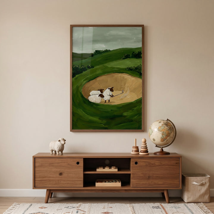 Sand bunker woolly sheep wall art of sheep golfing above a wooden media console with a globe in a minimalist room.