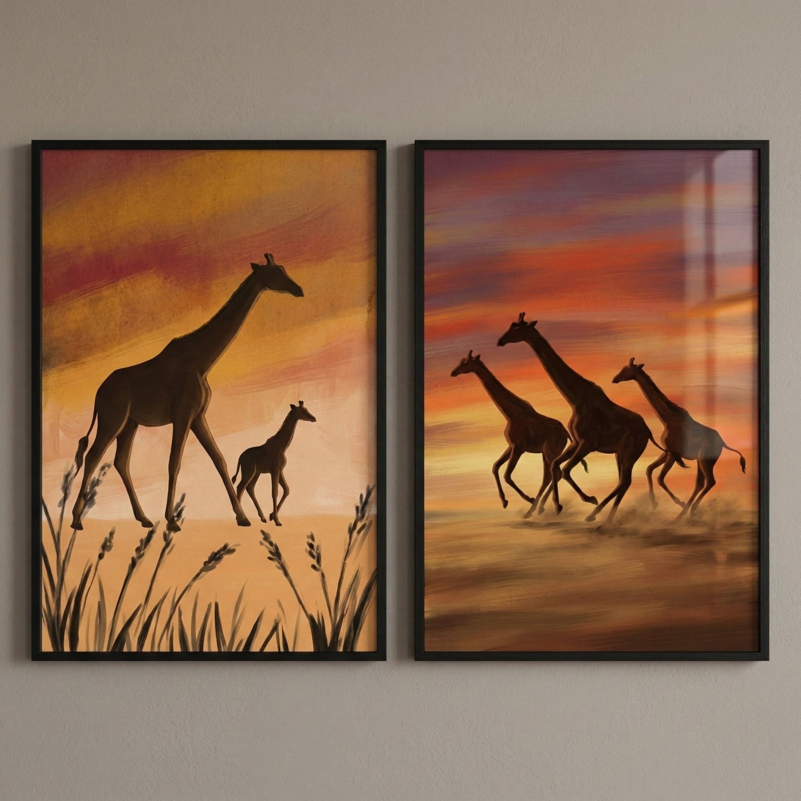 wo framed giraffe paintings in warm sunset colors show peaceful safari scenes. One artwork shows a tall giraffe walking beside a small calf through tall grass under an orange sky. The other shows three giraffes running together across a dusty landscape with a vivid red and gold sunset behind them.
