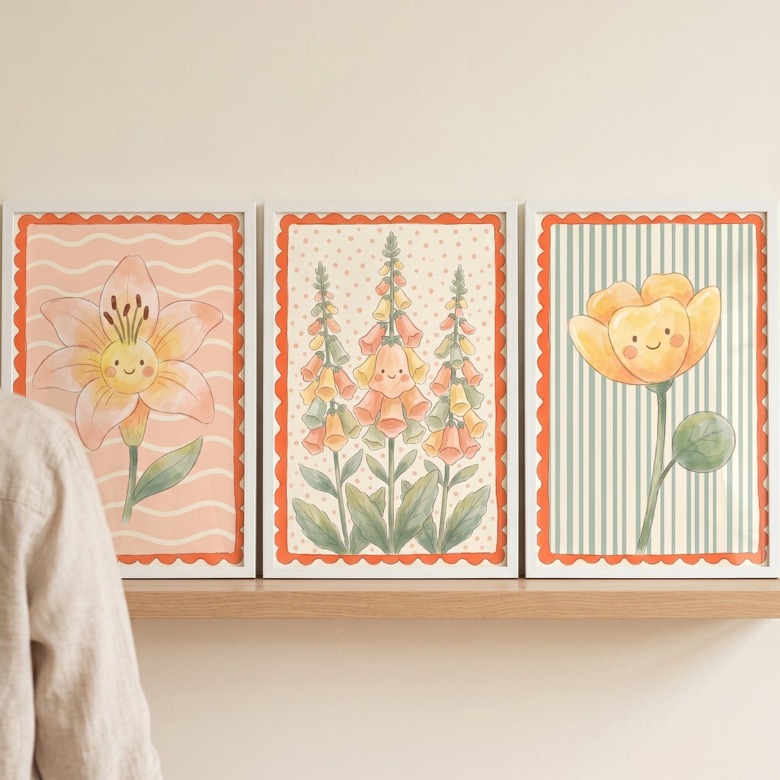 Scalloped border smiling flower wall art set of 3 features a lily, foxgloves, and yellow flower on a wooden shelf.