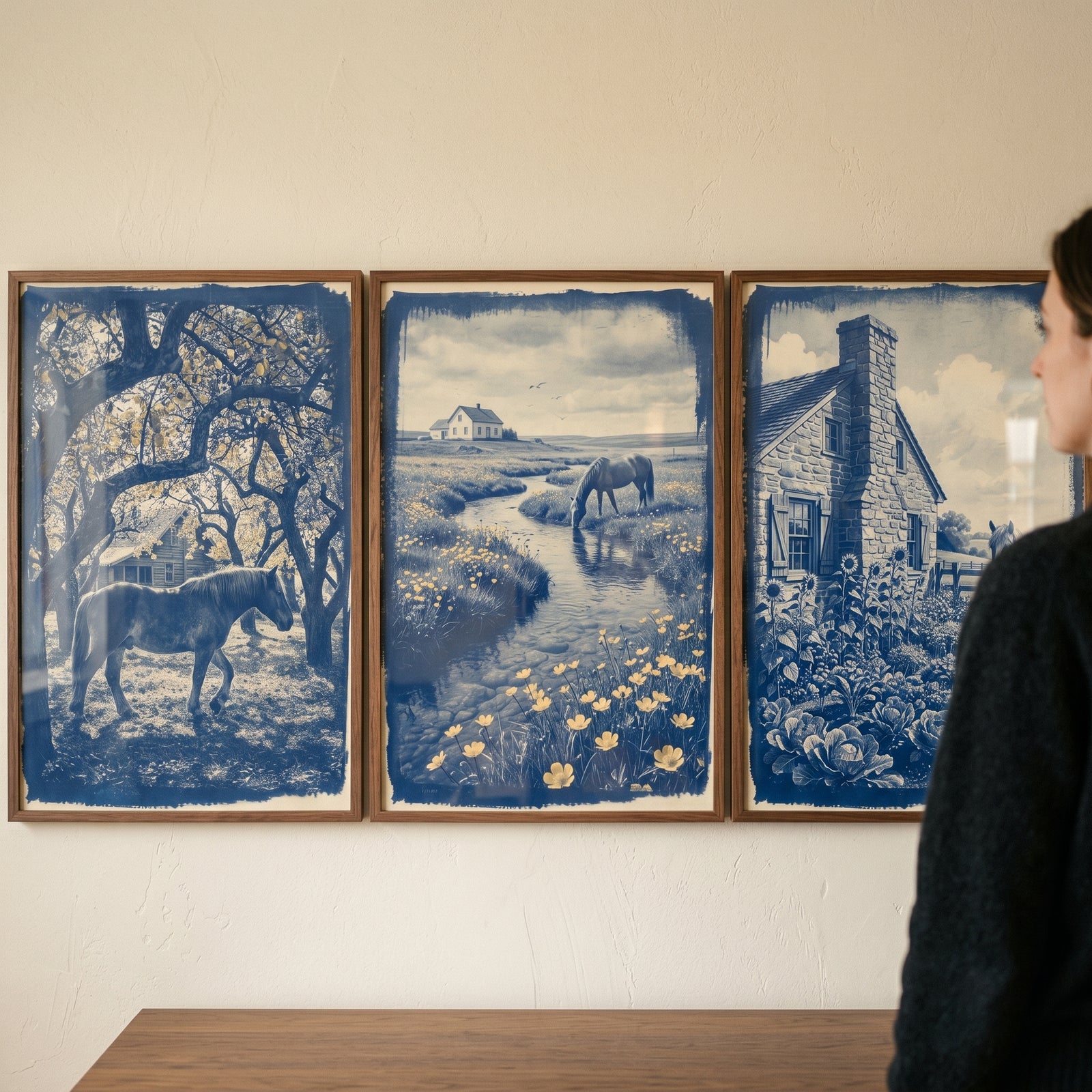 Scenic indigo monochrome horse wall art set of 3 featuring horses and farmhouses in rural landscapes on a neutral wall.