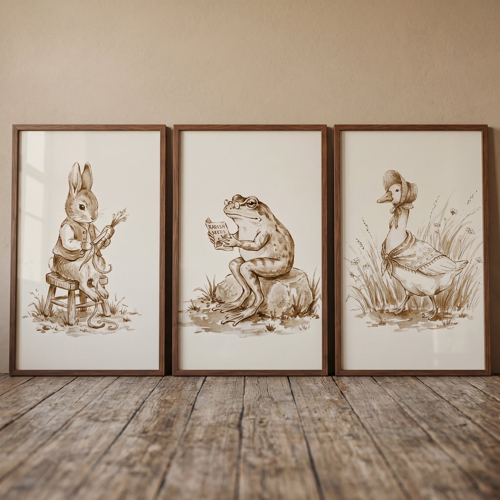 Sepia watercolor garden animal wall art set of 3 with a rabbit eating a carrot, a frog reading, and a goose in a bonnet.