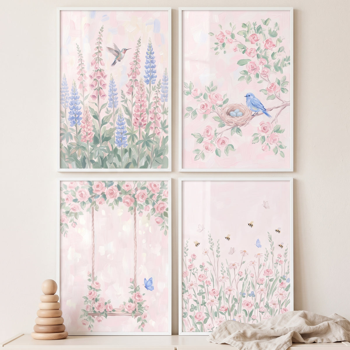 Serene blush pink garden wall art set of 4 with a hummingbird, bluebird nest, floral swing, and a meadow with bees.