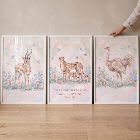 Serene floral african animals wall art set of 3 with an antelope, cheetah with cub, and ostrich under a biblical blessing.