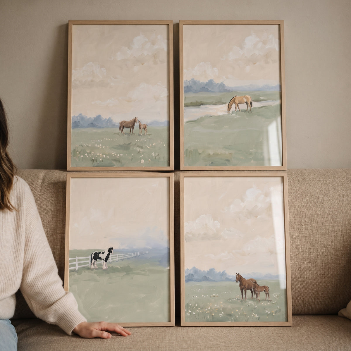 Serene impressionist meadow horses wall art set of 4 in light wood frames featuring horses in soft, muted field landscapes.