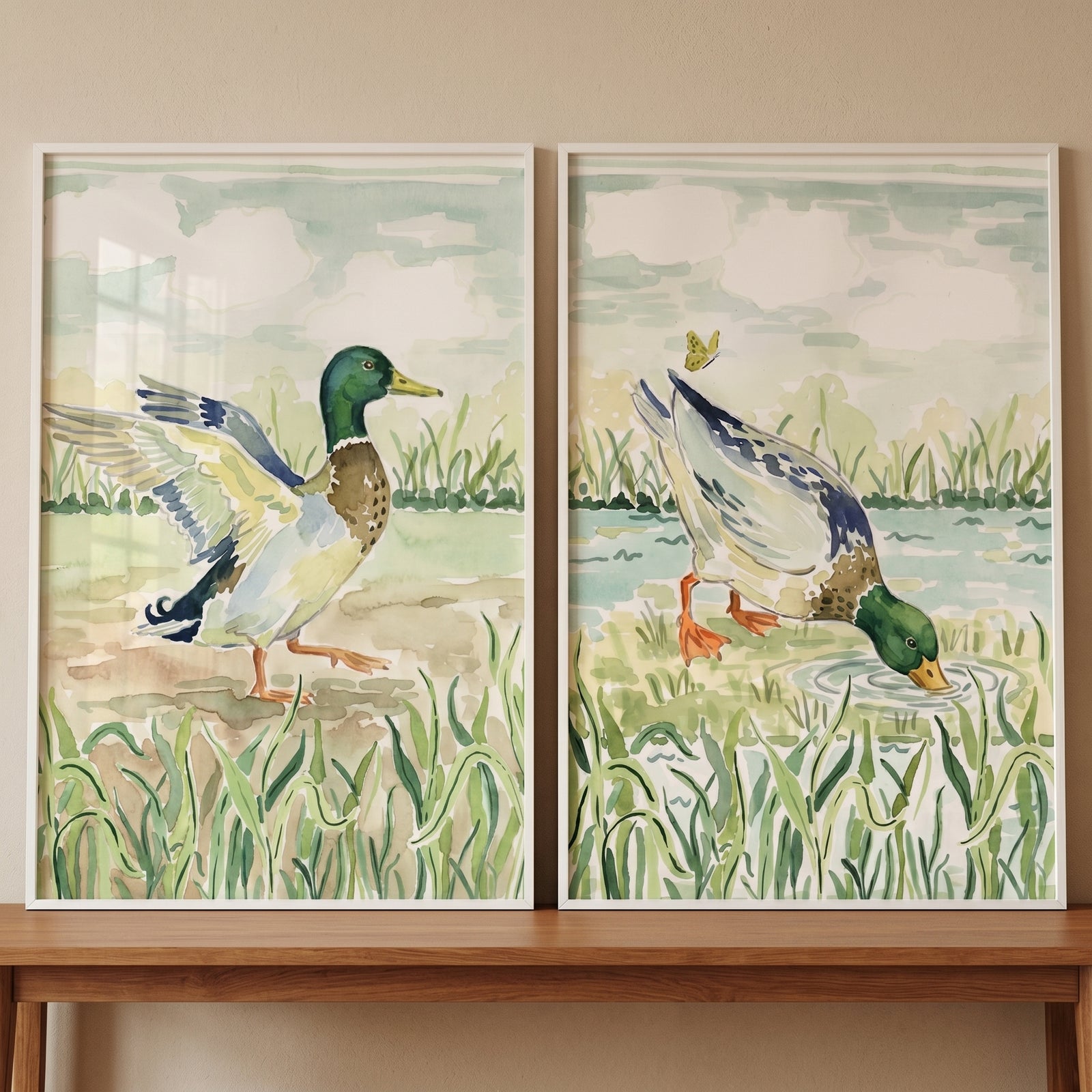 Serene mallard duck wall art set of 2 features watercolor illustrations of ducks in a grassy marsh setting.