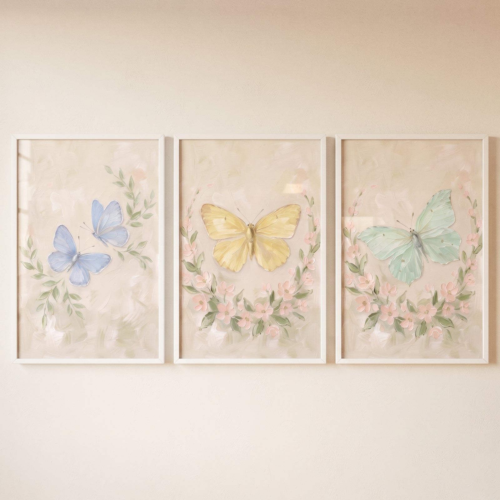 Serene meadow floral butterfly wall art set of 3 features blue, yellow, and green butterflies within soft floral wreaths.