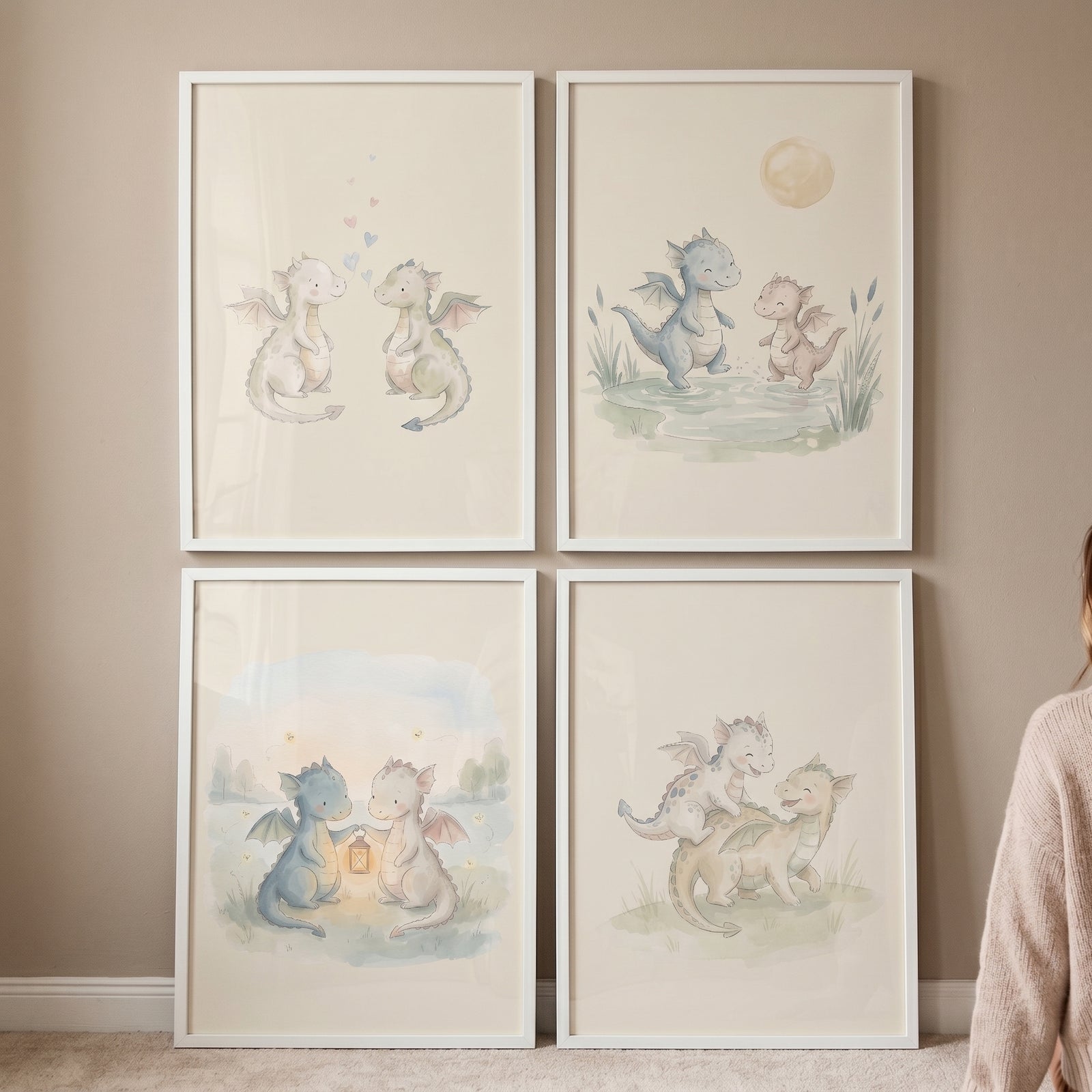 Serene pastel baby dragons wall art set of 4 features whimsical creatures in white frames on a neutral wall.