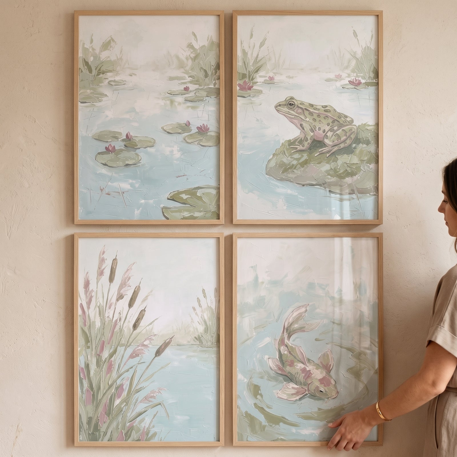 Serene sage aquatic nature wall art set of 4 featuring a frog, koi fish, and lily pads in light wood frames on a wall.