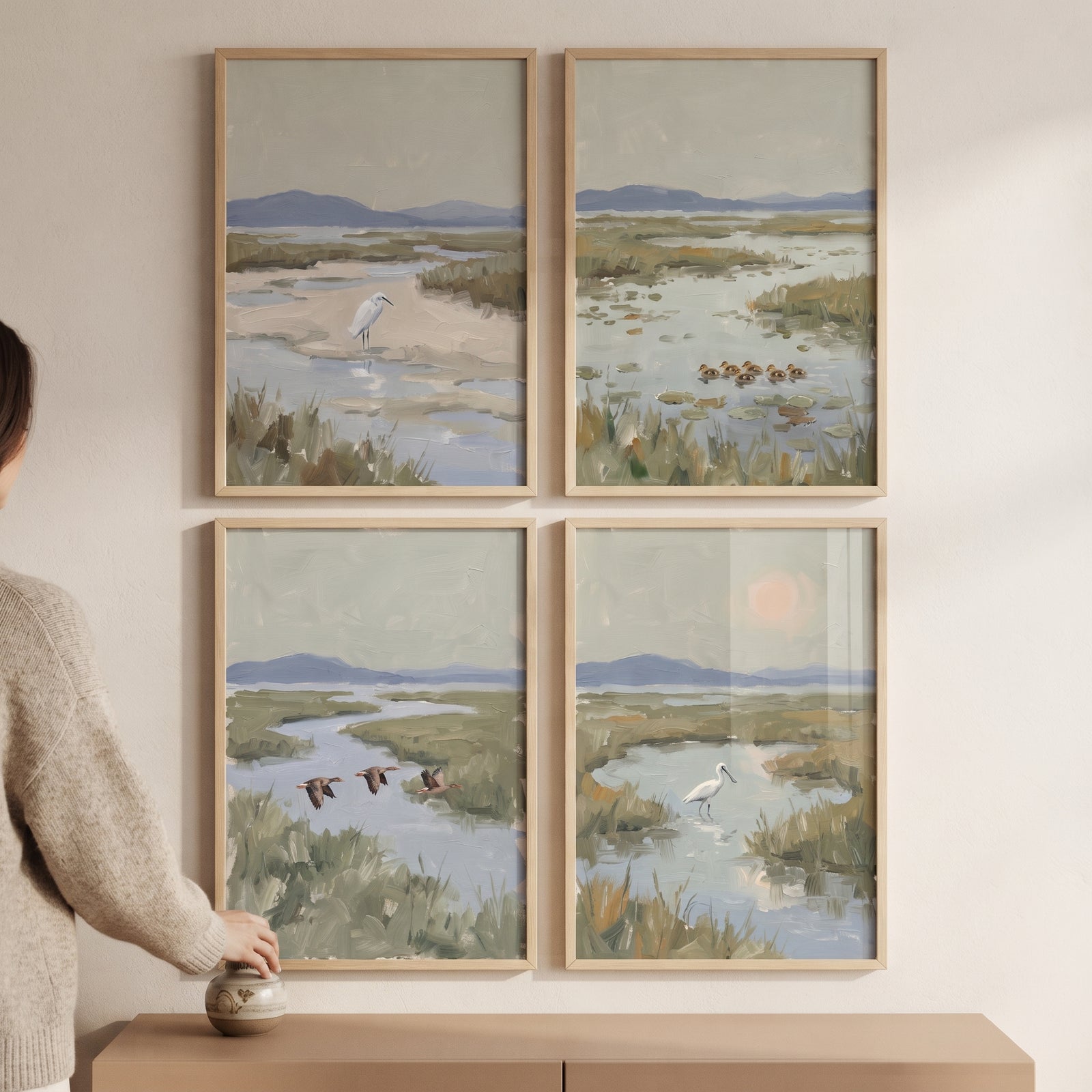 Serene sage coastal bird wall art set of 4 featuring marshy landscapes with herons and ducks in light wood frames.