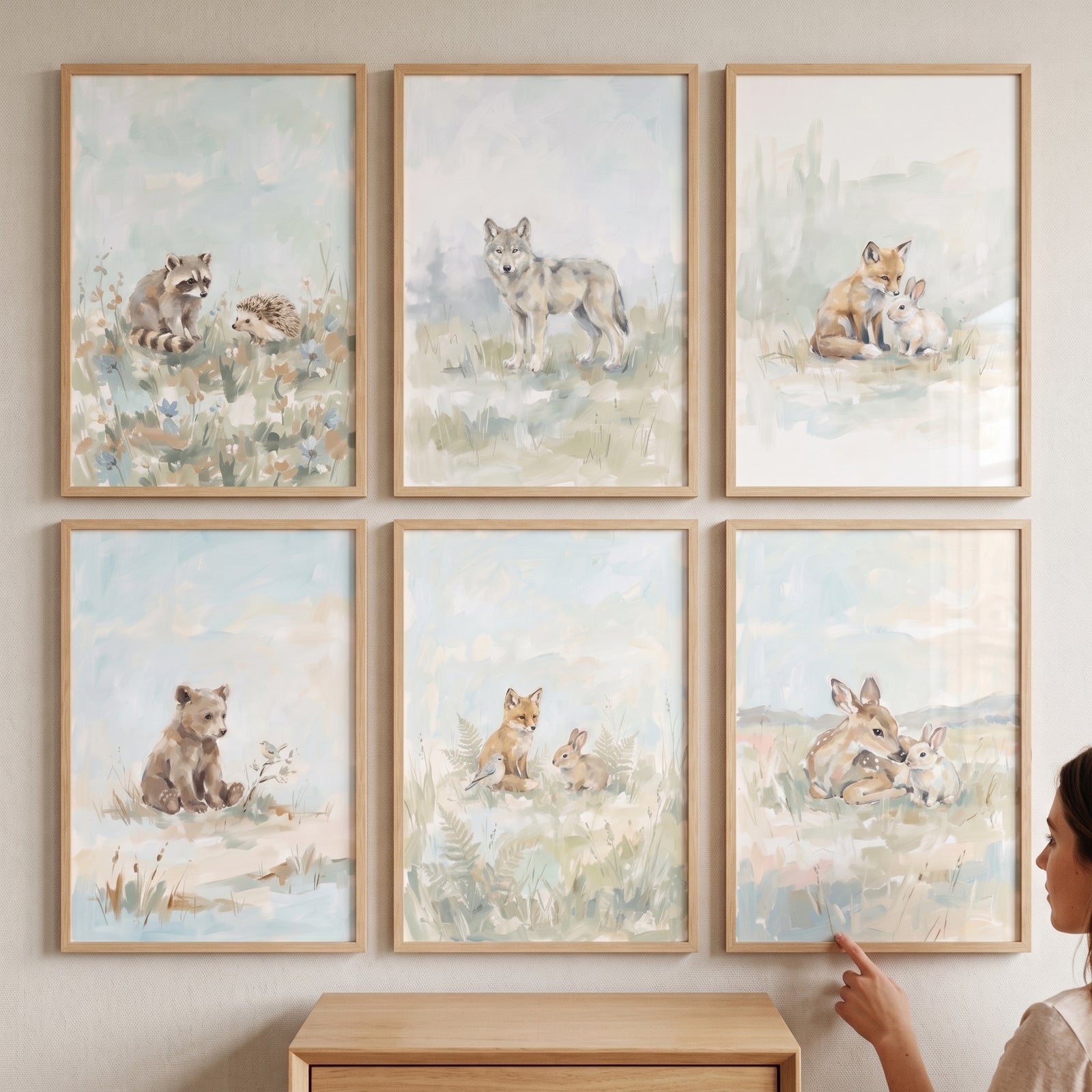 Serene sage forest animals artwork set of 6 frames on a wall featuring a bear, wolf, and deer in soft, muted tones.