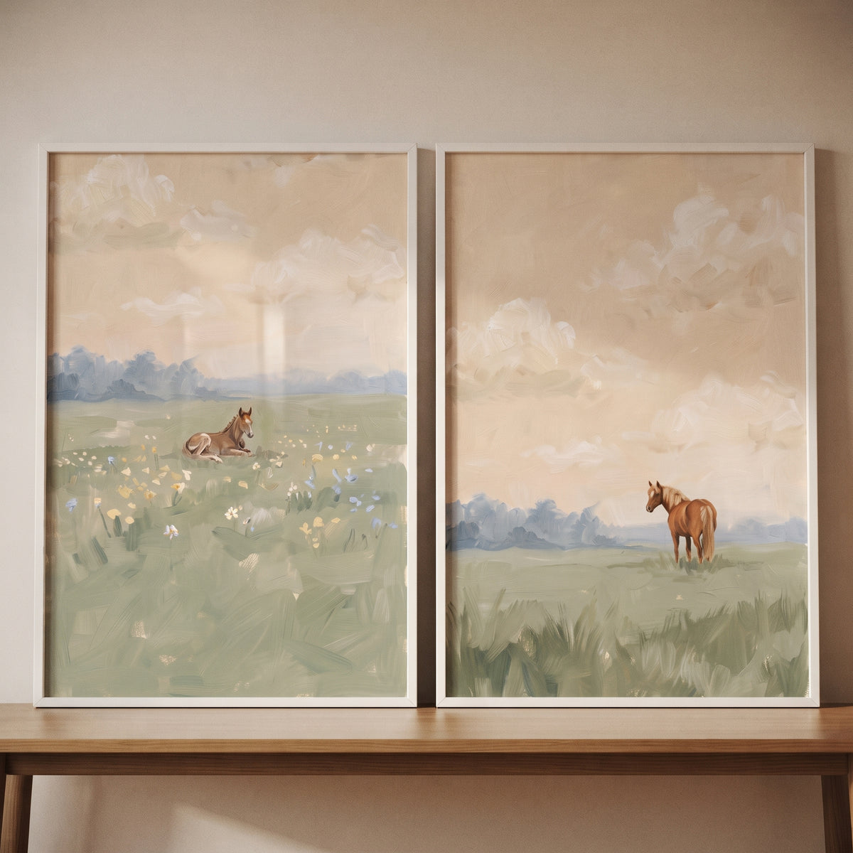 Serene summer field horse wall art set of 2 featuring horses in soft meadows, displayed on a wooden table.