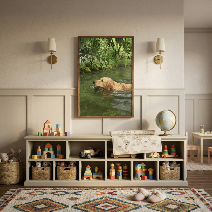 Neutral nursery with toy storage and colorful wooden blocks beneath a framed painting of a golden retriever swimming through green water under leafy branches. The artwork creates a calm nature inspired focal point that adds warmth and gentle movement to the space.