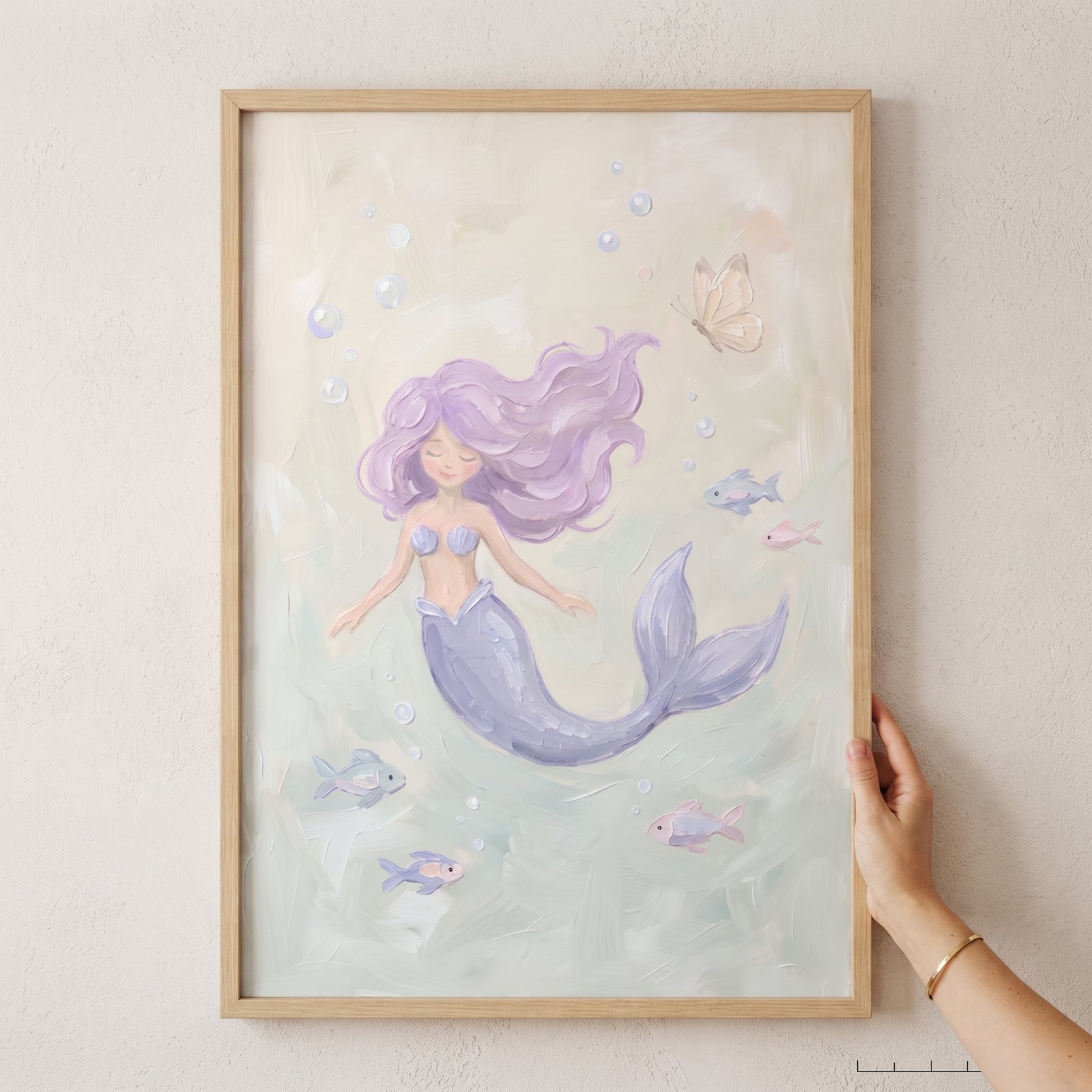 Serene swimming pastel mermaid wall art with lavender hair and colorful fish in a light wood frame.