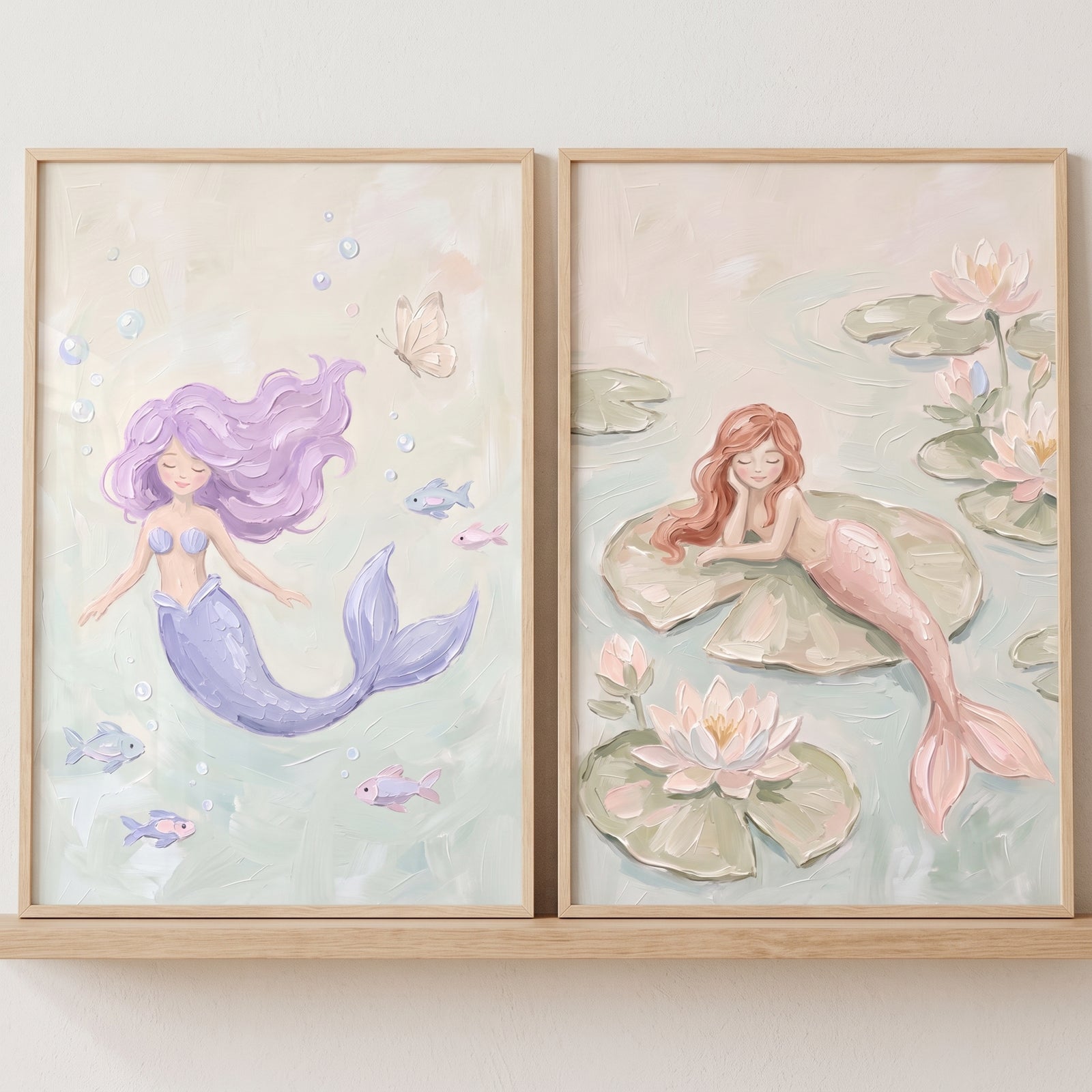 Serene whimsical pastel mermaid wall art set of 2 with a purple mermaid swimming and a pink mermaid on a lily pad.