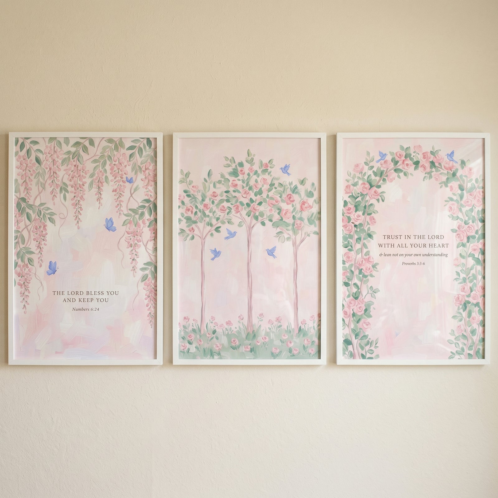 Shabby chic pink garden wall art set of 3 with floral motifs, blue butterflies, and scripture in white frames.