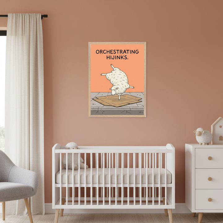 Modern nursery with a white crib and dresser against a terracotta wall. A framed cartoon print of a white sheep balancing on a cardboard box with text "ORCHESTRATING HIJINKS." hangs above the right side of the crib.