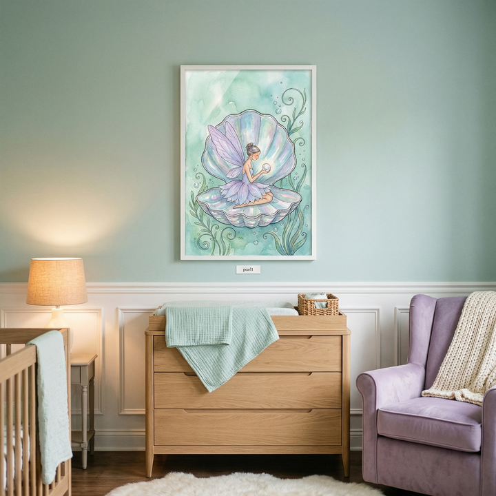 A light-filled nursery features seafoam green walls and white wainscoting. Above a natural wood dresser, a framed piece of artwork depicts a whimsical fairy with lavender wings perched inside an iridescent seashell. The fairy gazes at a glowing pearl in her hands, set against a soft watercolor-style background of aquatic plants and bubbles. A light green muslin cloth and a small woven basket rest atop the dresser. 
