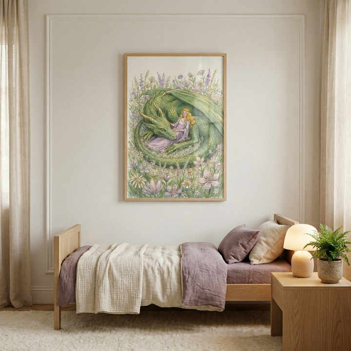A light-filled bedroom features a framed illustration on a white wall. The artwork depicts a large green winged creature curled in a field of wildflowers with a person in a purple dress resting against it. Below the frame is a wooden bed with cream and dusty purple linens. To the right, a wooden nightstand holds a warm, mushroom-shaped lamp and a small potted plant. Soft beige curtains and a plush white rug complete the peaceful and cozy scene.