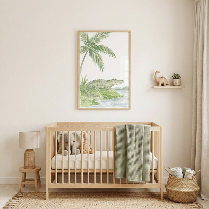 Neutral nursery room featuring a wooden crib and smiling green alligator wall art hanging above.