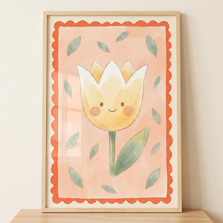 Smiling yellow tulip flower wall art in a light wood frame with a scalloped orange border and scattered green leaves.