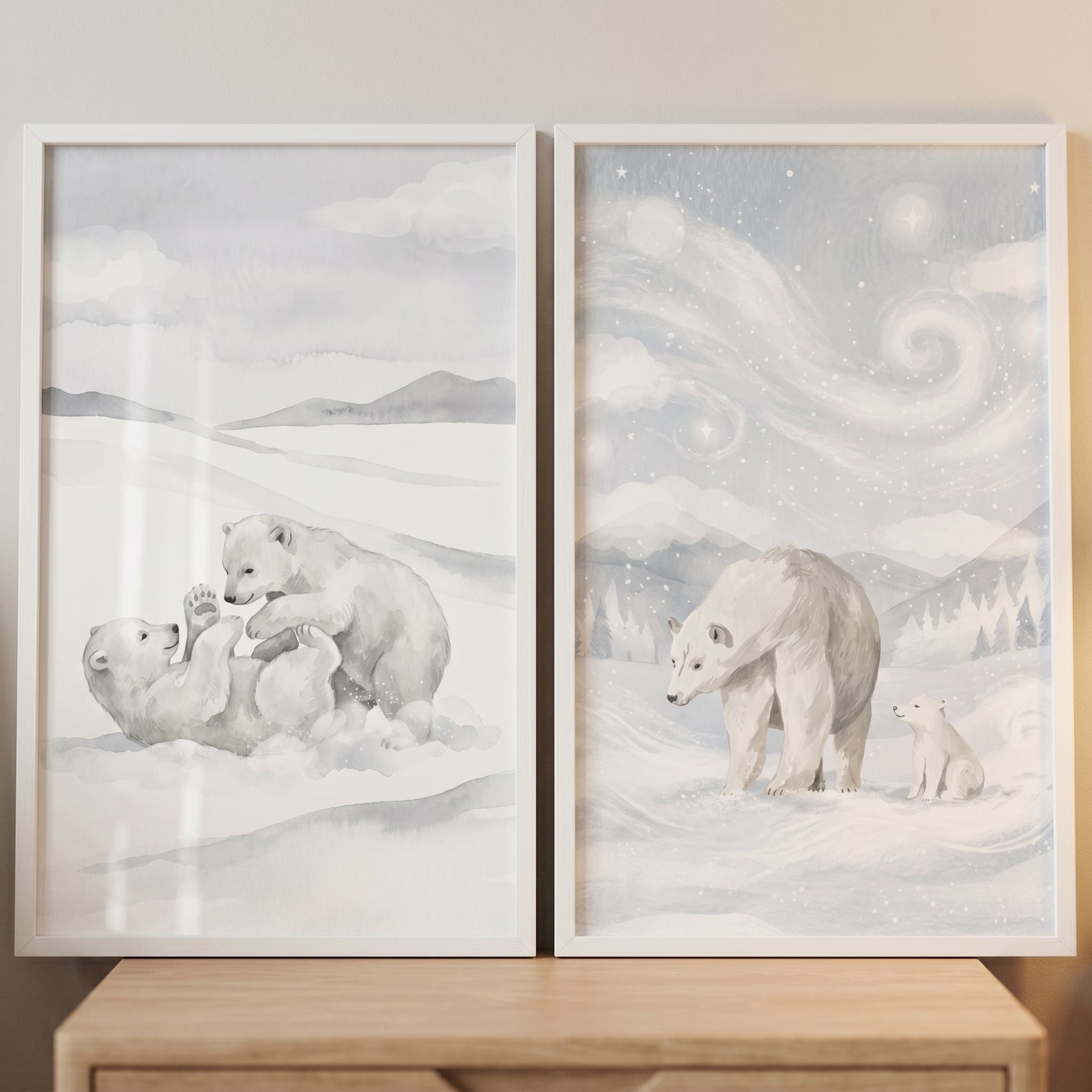 Snowy arctic polar bear wall art set of 2 with soft illustrations of cubs playing and an adult bear in the snow.