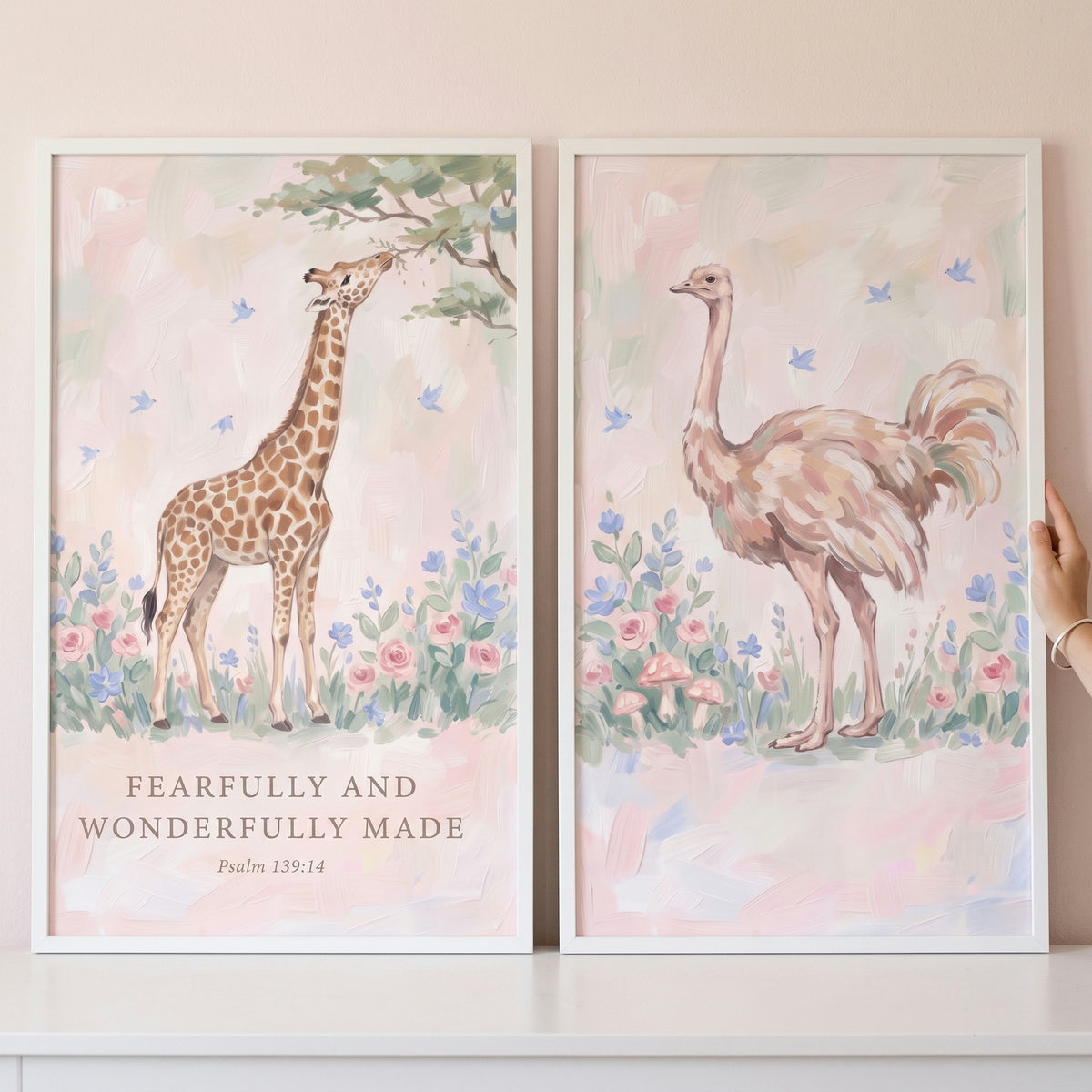 Soft blush botanical animals wall art set of 2 with a giraffe, ostrich, and Psalm 139:14 bible verse in a floral garden.