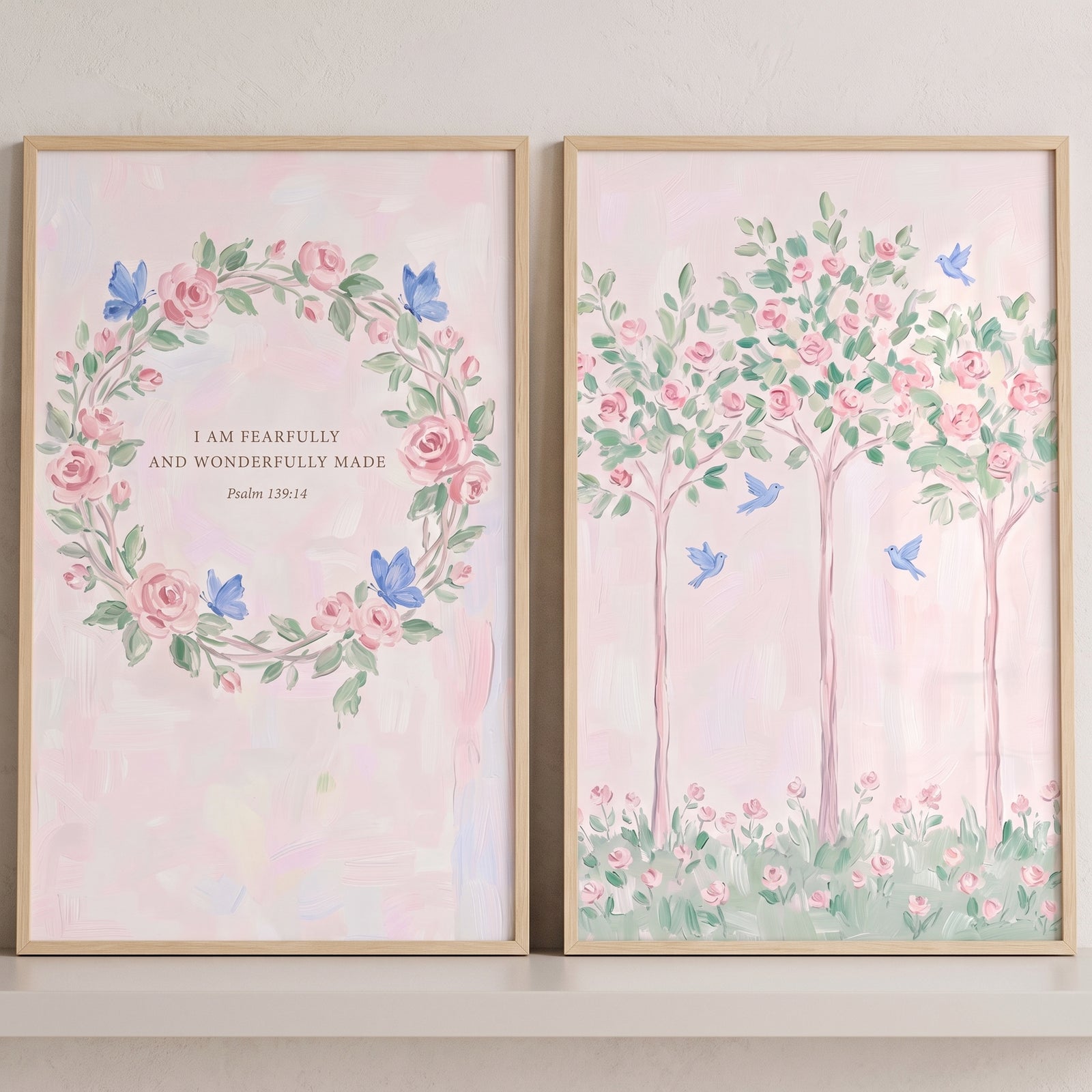 Soft blush rose garden wall art set of 2 with a floral scripture wreath, blue butterflies, and pink trees with blue birds.